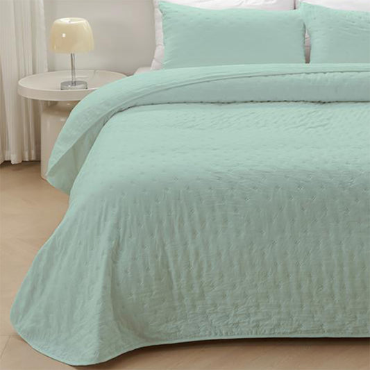 Colcha de retalhos geométrica com enchimento fino. Cor bege.