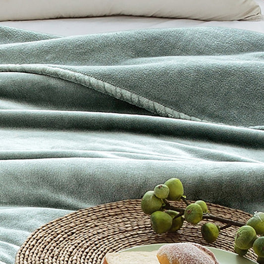 Manta de lã extra macia. Cor verde água.