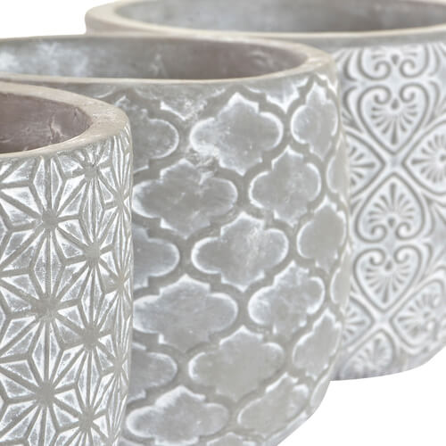 Floreira de cimento elegante e durável com uma forma geométrica de estrelas. Ideal para Exteriores e Interiores.