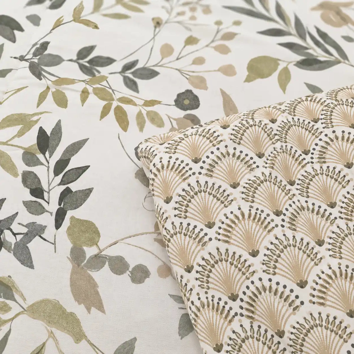 Close-up of the main botanical print with delicate green leaves and natural details on a bright light background.