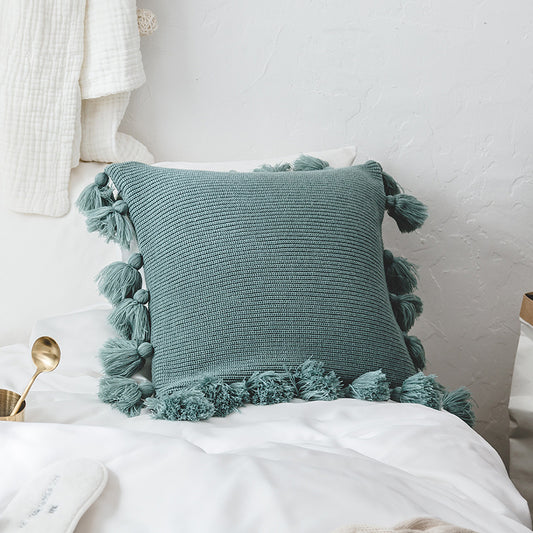 Funda de cojín tejido con borlas color azul turquesa. - Oma Home