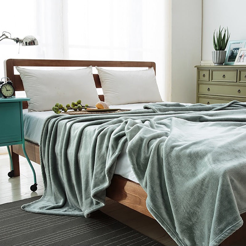 Manta de lã extra macia. Cor verde água.